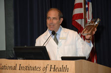 Photo of Dr. Gallin holding the Dirt Award