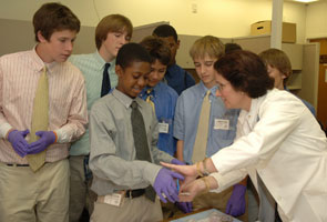 Photo of Dr. Maria Merino with Landon School Students