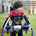 child with special walking apparatus