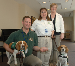 Volunteer Week awardees the Cohens with their pups and Colunteer coordinator Courtney Duncan