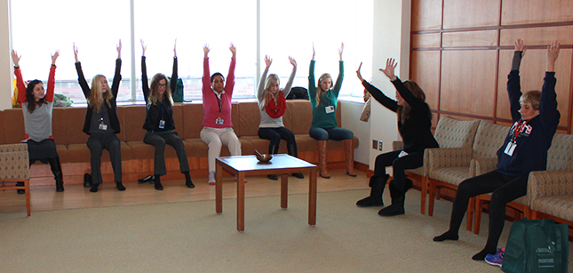 Clinical Center patients and caregivers doing yoga