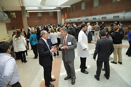 Dr. John I. Gallin (center) talks with Clinical Center staff at a reception following the 2016 Clinical Center Director's Annual Address Awards Ceremony on Dec. 16.