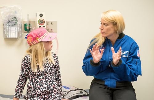 Rubins speaks with pediatric patient 