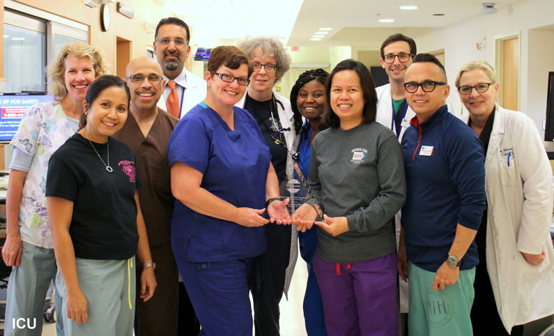 Eleven members of the Intensive Care Unit holding the 2017 Excellence Award