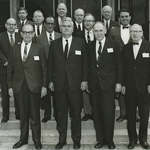 Black and White photo of the first meeting of the National Advisory Eye Council (13 men) gathering on steps