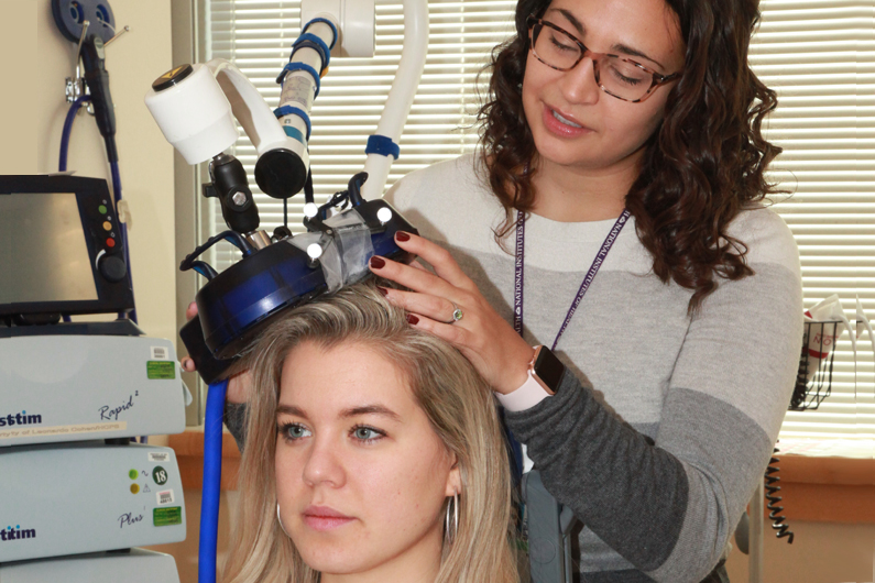 two women performing a brain study