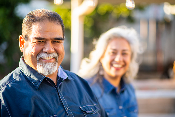 Older man with older woman smiling