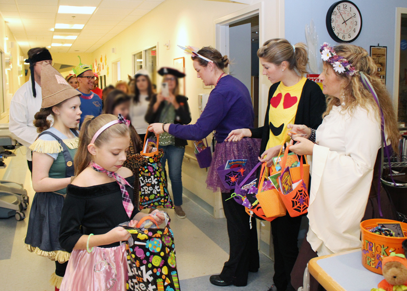 Pediatric patients are given candy by departments at the Clinical Center