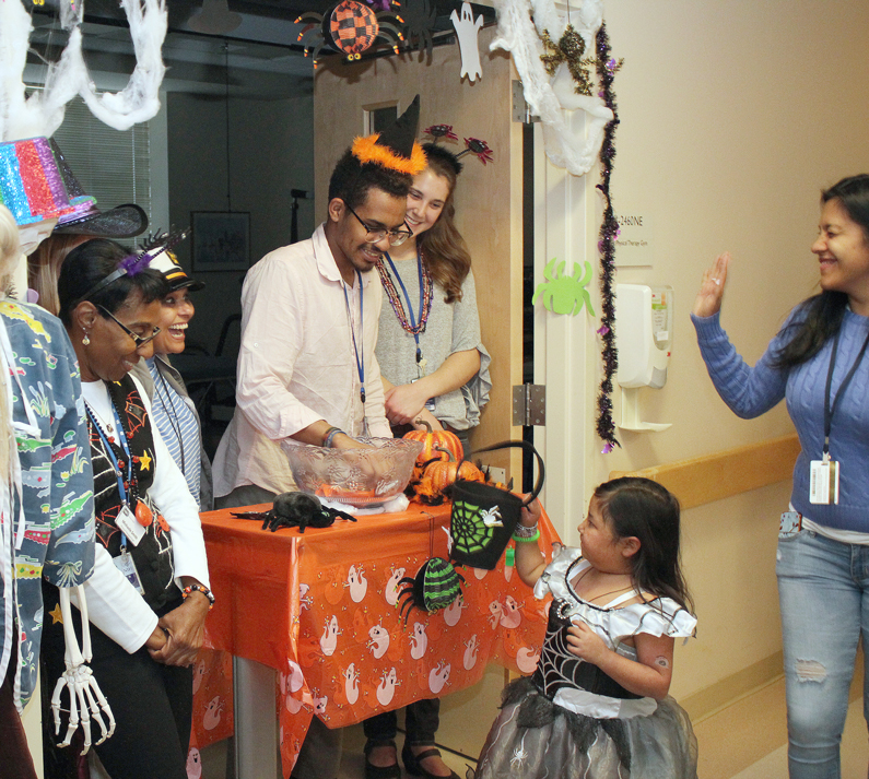 Pediatric patients are given candy by departments at the Clinical Center