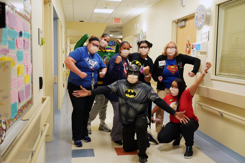Members of the NIH Clinical Center Recreational Therapy program dressed in Halloween costumes