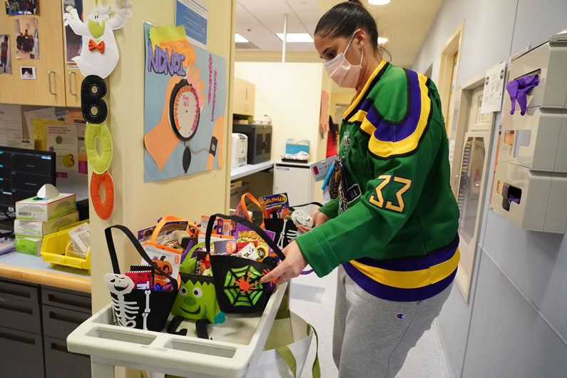 Nurse Katrina Fernandez helped deliver Halloween goodies, provided by The Children's Inn at NIH, to the Clinical Center pediatric patients
